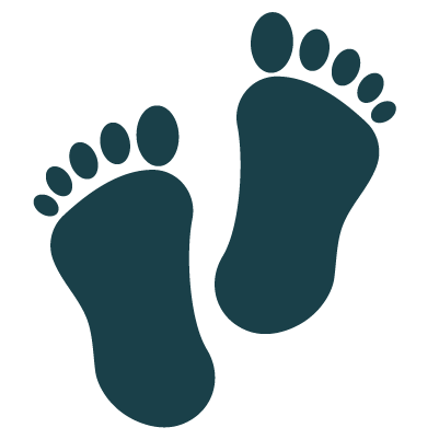 An illustration of two simplified human footprints, facing upward, with a dark teal color. The footprints display five toes each and are presented in a stylized and minimalist design.