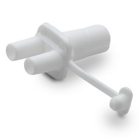 A small, white plastic connector with a rounded end and two cylindrical protrusions extending from one side. The connector has a narrow, curved tube attached to it, which ends in a small rounded tip. The overall shape resembles a simplified plug or fitting, commonly used in various applications. The background is plain and light, emphasizing the object.