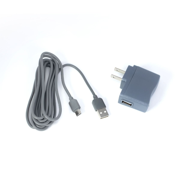 A gray USB charging cable is shown alongside a gray wall adapter. The cable has a USB-A connector on one end, and a micro USB connector on the other end. The wall adapter features two prongs for plugging into an electrical outlet and includes a USB-A port for connecting the cable. The background is white, enhancing the visibility of the items.