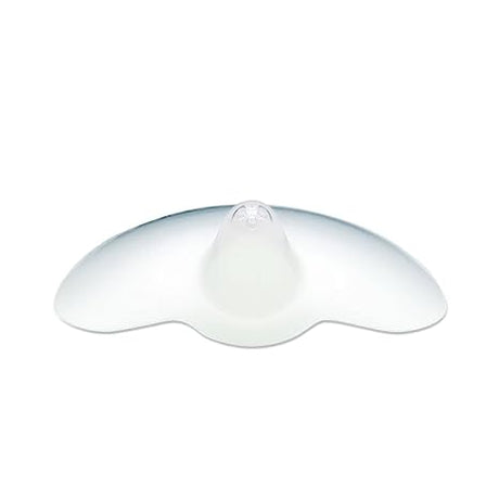 A translucent silicone nipple shield with a rounded central projection and wide, curved edges designed to aid breastfeeding. The shield has a smooth surface and is primarily clear, allowing for light to pass through.