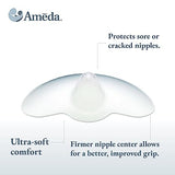 Image of a nipple shield with text descriptions. The shield is semi-transparent and features a rounded shape with a firmer central area. The background is light, and the logo "Ameda" is positioned in the top left corner. Text on the left highlights "Ultra-soft comfort," while text on the right states "Protects sore or cracked nipples." Below these descriptions, another note reads, "Firmer nipple center allows for a better, improved grip."