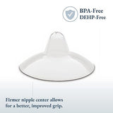 An image of a clear baby bottle nipple with a wide base and a firm, rounded center. The nipple has an elongated shape with a small opening at the top. Text in the upper right corner states "BPA-Free" and "DEHP-Free," while the bottom left corner includes a description that reads "Firmer nipple center allows for a better, improved grip." The background is light to emphasize the nipple's design.