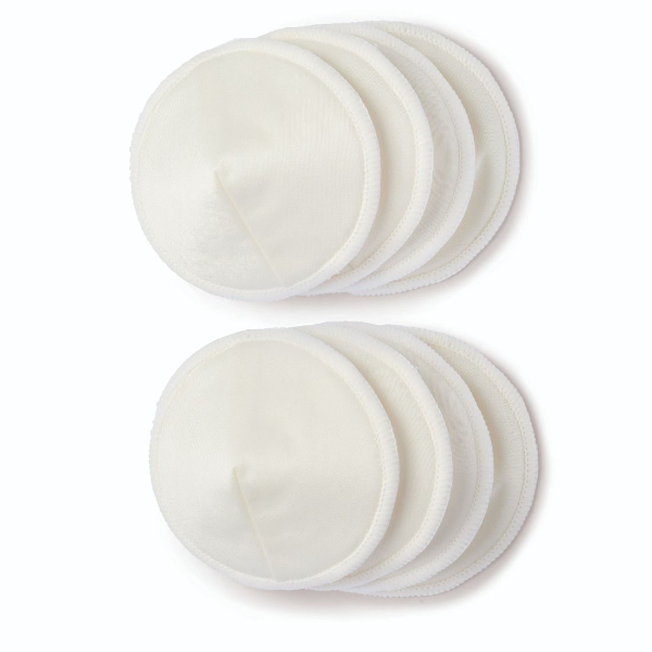 A stack of twelve circular, soft, white cotton breast pad liners arranged in two groups of six, with one group slightly overlapping the other, placed on a plain white background.